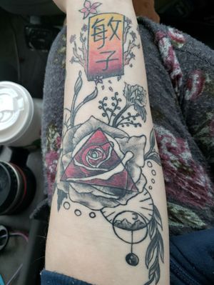 This tattoo is not only my first but it is my own design with additions from my artist. I made this design for my grandmother who passed away a couple years ago. She was a huge part of my life and I miss her a lot. It has a mistake on it but that's my fault. The Japanese on top is my grandmothers name. Toshiko 