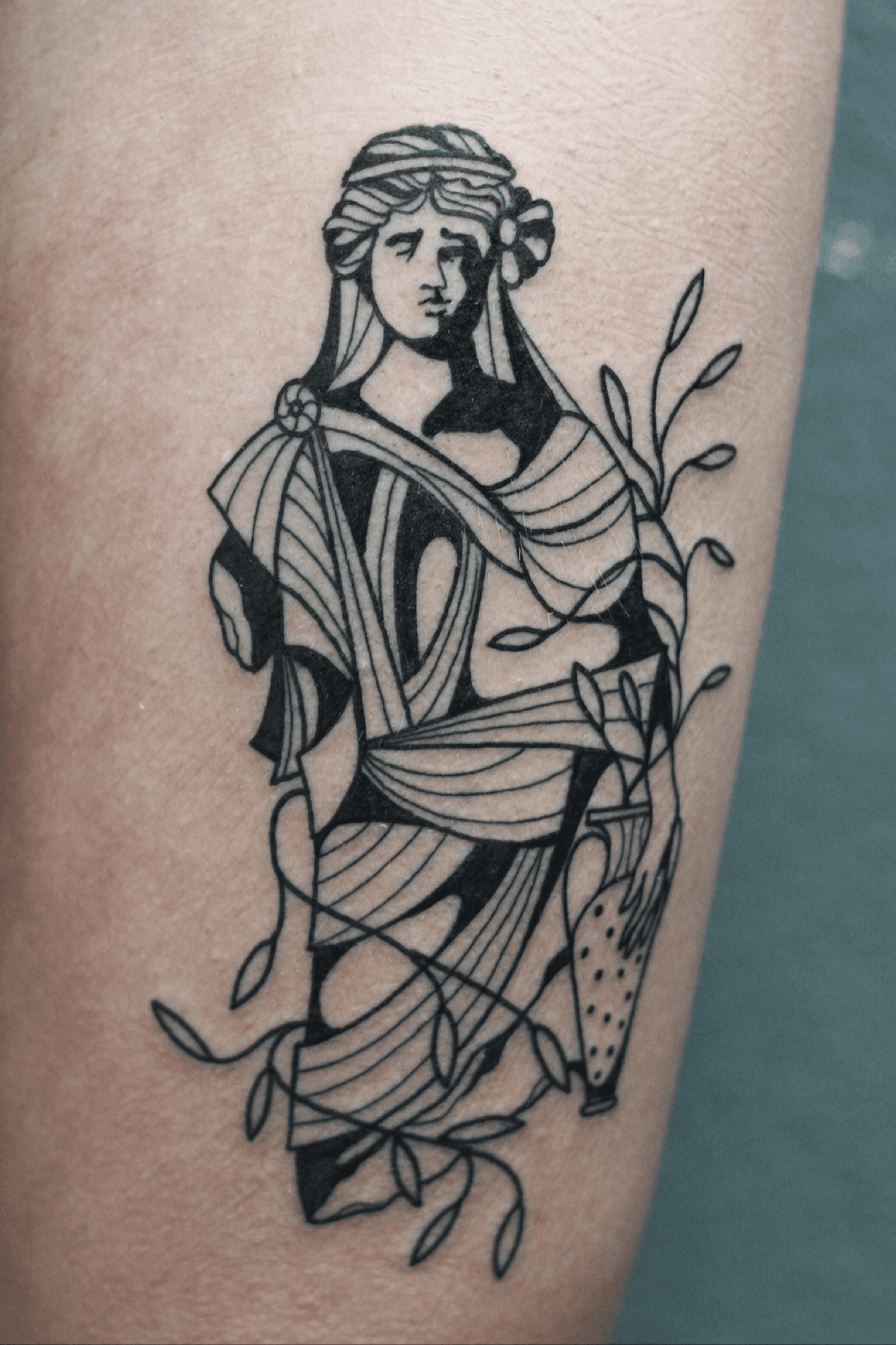 Realistic roman sculpture tattoo on the bicep inspired
