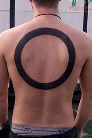 Back hole tattoo