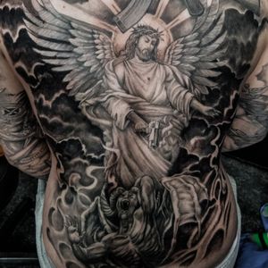 Jesus and evil battle with gun tattoo