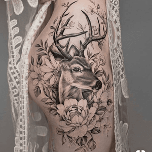 Floral stag hip tattoo