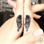Wings finger tattoo