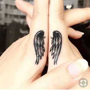 Wings finger tattoo
