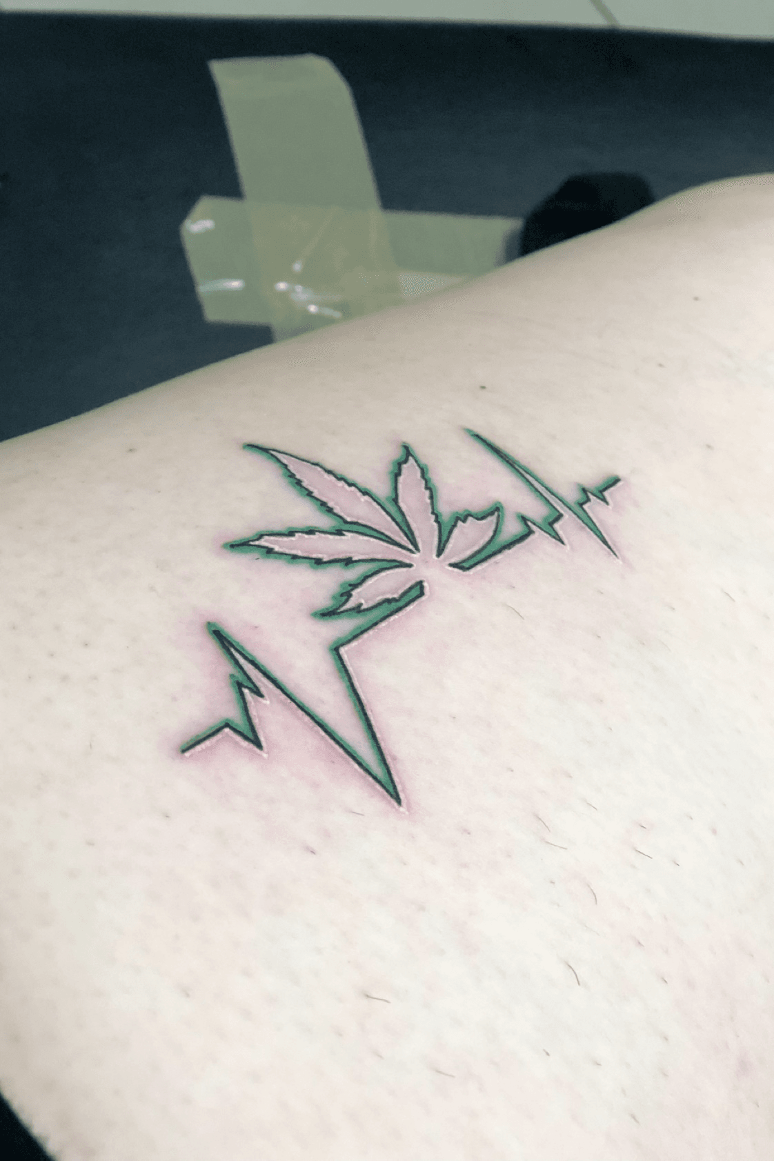 weed symbol tattoo