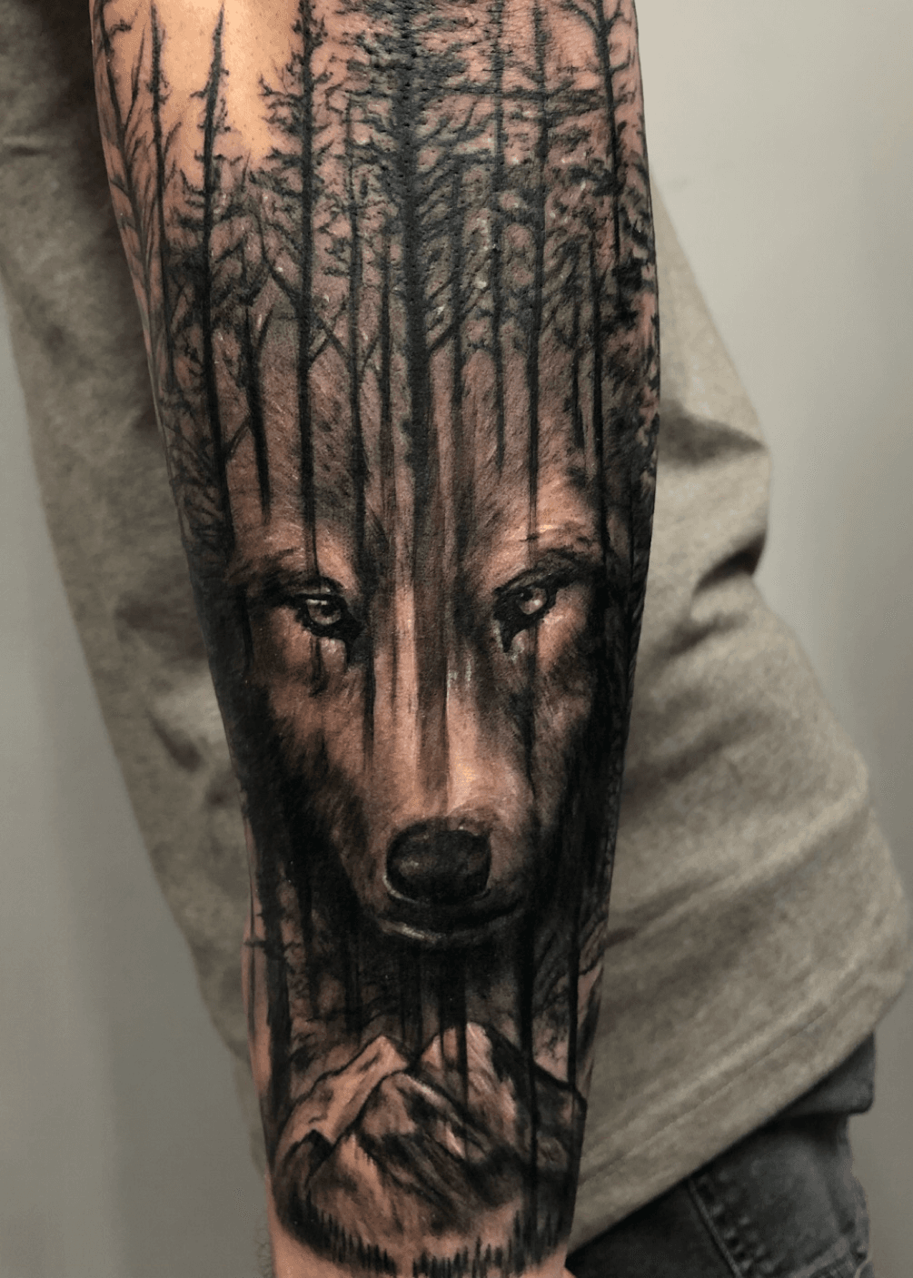Tattoo uploaded by Hidden Gem Tattoo Studio  Wolf mountain and forest  tattoo which is a coverup  Tattoodo