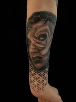 Black and grey female portrait with rose and geometric designs