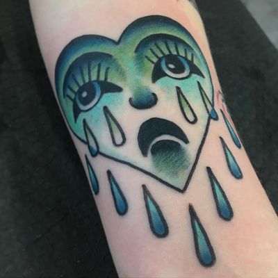 Tattoo by Joshua Constein #JoshuaConstein #cryinghearttattoos #cryinghearttattoo #cryingheart #heart #tears #love #heartbreak #blue #color #traditional
