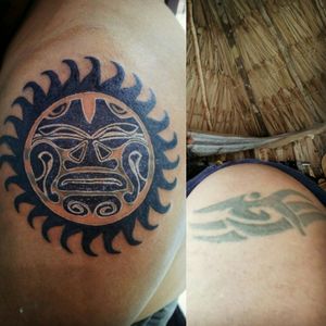 Maori sun tribal black coverup tattoo