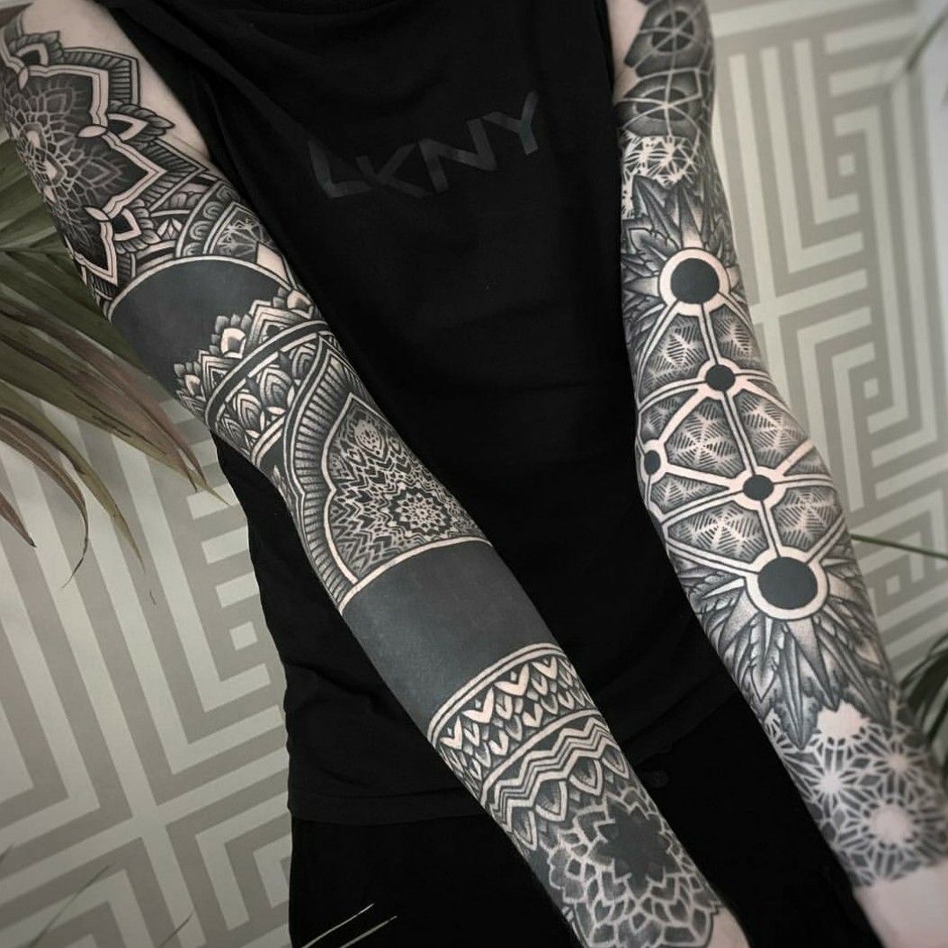 Geometric and blackout sleeves tattoo