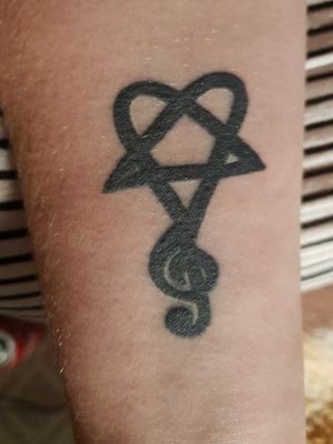 This is my H.I.M/treble cleft tattoo.This is the first tattoo I got at 18.I got this tattoo because music means so so much to me and because H.I.M is my favourite ever band.