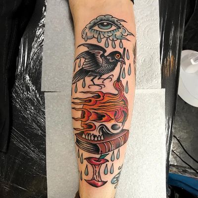 Tattoo by Sam Ricketts #SamRicketts #eyetattoos #eyetattoo #eye #psychedelic #surreal #strange #color #traditional #skull #death #fire #crow #bird #feathers #rain #tears #book #apple