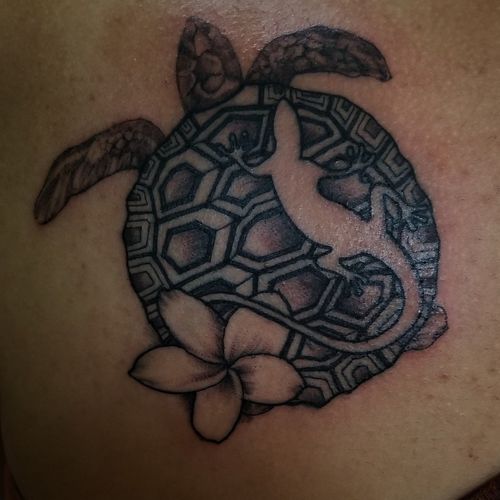 Freehand polynesian tattoo. This tattoo has alot of meaning behind the design. The turtle represent my clients grandmother. Turtle have a large spiritual donne tyion to folders who have passed away. The negative space gecko r represent the passage way the spirit can pass through.  The plumeria represent calmness and understanding 