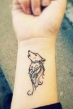 Howling wolf on inner forearm