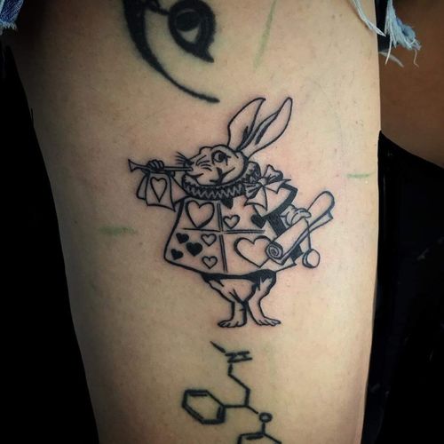 Fun custom tattoo featuring the white rabbit from Alice and wonderland