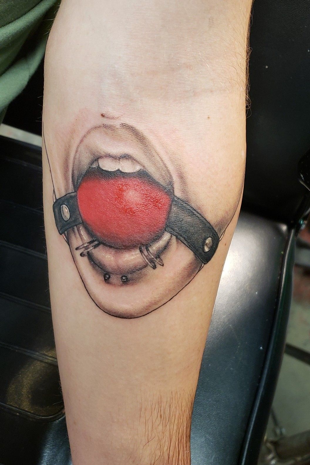 Ball gag tattoo