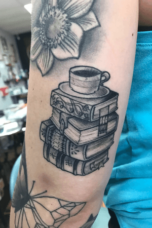 Healed stack of books, left arm