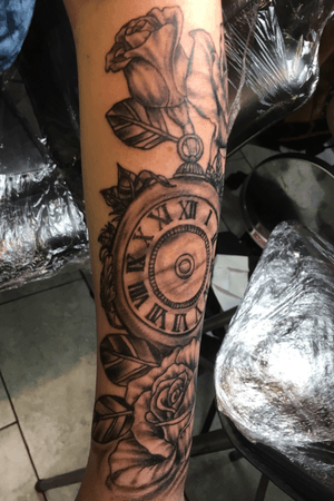 Clock and roses memorial tattoo 
