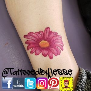 Fun little flower tattoo. Message me with any questions or to setup your next tattoo. Please like and follow me @tattooedbyjesse FB, IG, SC, pinterest, tumblr, twitter, tattoodo app, and for my artist page; www.facebook.com/tattooedbyjesse #TattooedByJesse #ComeGetSomeInk #LoyaltyTattooCompany #DynamicBlack #EternalInks #Tattoo #Tattoos #MichiganTattooArtists #MichiganPiercers #Tattooed #daisy #flower #color