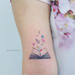 Tattoo by Jacke Michaelsen #JackeMichaelsen #booktattoos #booktattoo #book #literary #novel #reading #novel #small #flower #floral #tulip #heart #butterfly #illustrative #sparkle #paperplane