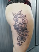Flowers and mandalas thigh tattoo 