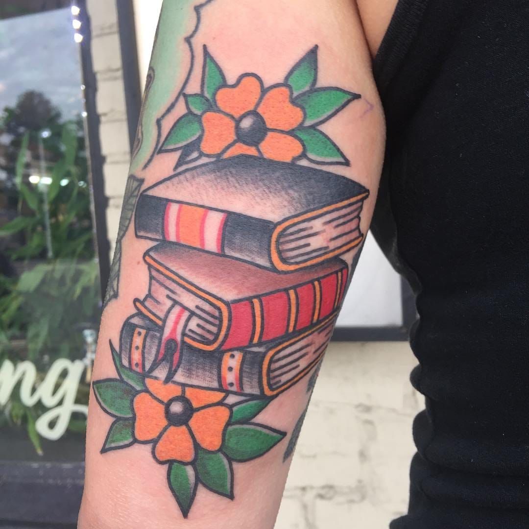 Books and flowers traditional tattoo  Book tattoo Bookish tattoos Traditional  tattoo flowers