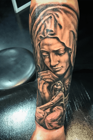 Religious sleeve in progress. Black and grey realistic tattoo
