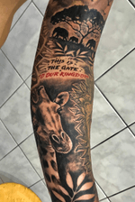 Realistic black and grey sleeve tattoo in progress.