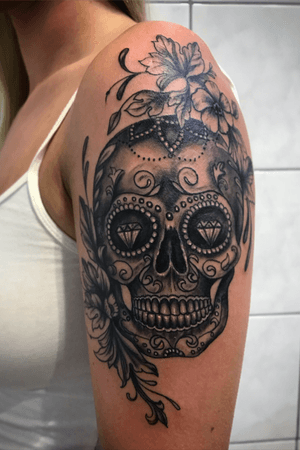 Sugarskull and flowers. Realistic tattoo black and grey