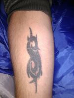Slipknot tribal "S" - My very first tattoo. Age: 18yrs.