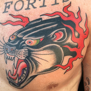 Panther head on chest 