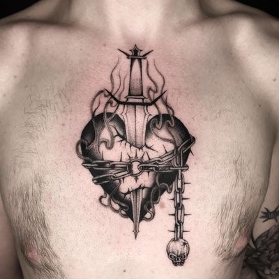 Tattoo by Sera Helen #SeraHelen #sacredhearttattoos #sacredhearttattoo #sacredheart #heart #fire #love #religious #sword #chain #skull #blackandgrey
