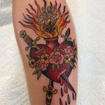 Tattoo by Chris Stuart #ChrisStuart #sacredhearttattoos #sacredhearttattoo #sacredheart #heart #fire #love #religious #color #traditional #rose #flower #iris #sword #blood