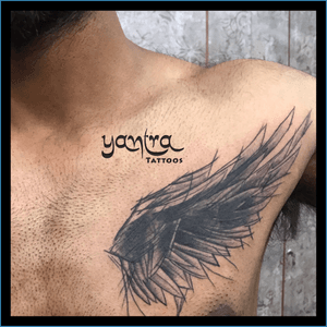 Name coverup tattoo using rough feather