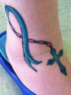 I want this tattoo for my Mom. She has Brain Cancer. So I want Black work with a grey ribbon.