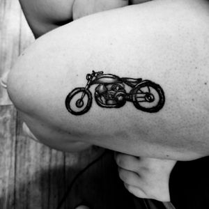Simplistic motorcycle thigh tattoo