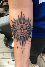 Black and grey sun tattoo