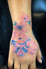 Painted flowers, tattooed on return client. 