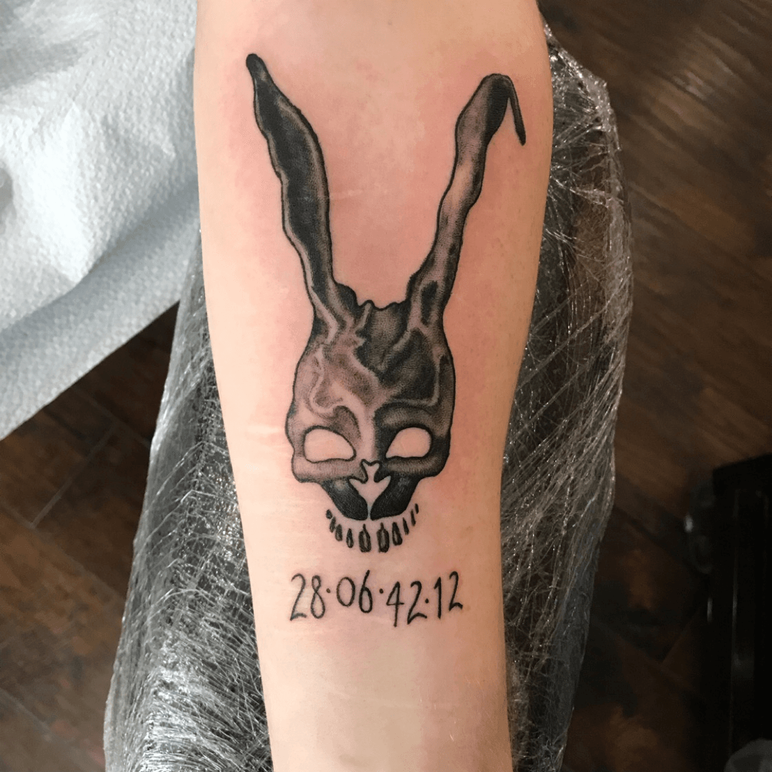 Tattoo uploaded by Jade Barrett  Black and grey Frank the Bunny from Donnie  Darko More to come on this one  blue ink splashes in the back for next  time   Tattoodo