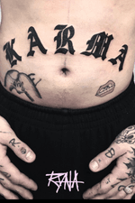 Close up of th KARMA belly tattoo #karma #bellytattoo #lettering #gothic #black #swisstattoo