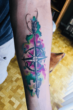 Watercolor compass with an arrow going through the middle. #watercolor #watercolortattoo #compass  #arrow #forearm 