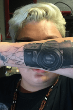 Canon camera with a spider web connecting to an existing tattoo (spider not done by myself)