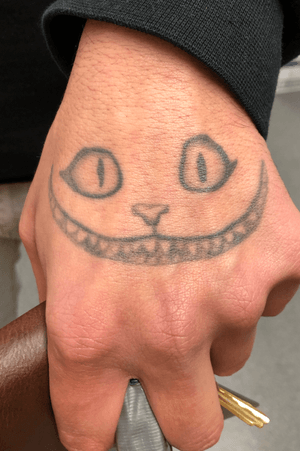 Cheshire cat hand tattoo #aliceinwonderland #wereallmadhere #cheshirecat 