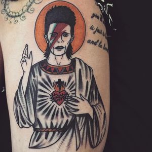 Tattoo by Cooley Tattooer #CooleyTattooer #tattoosoffamouspeople #famouspeopletattoos #famous #portrait #people #davidbowie #jesus #sacredheart #color #lightningbolt #ziggystardust #traditional