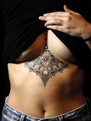 Dermal by @donk_onelove . Healed geometric mandala under boob tattoo by @Cido_tattoos .