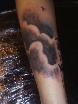 The clouds to the left of the tattoo tbat was done on my sister-in-law. Tattoo not 100% complete. Need to go through and polish the clouds and main tattoo. Will upload the complete tattoo after polish with before and after