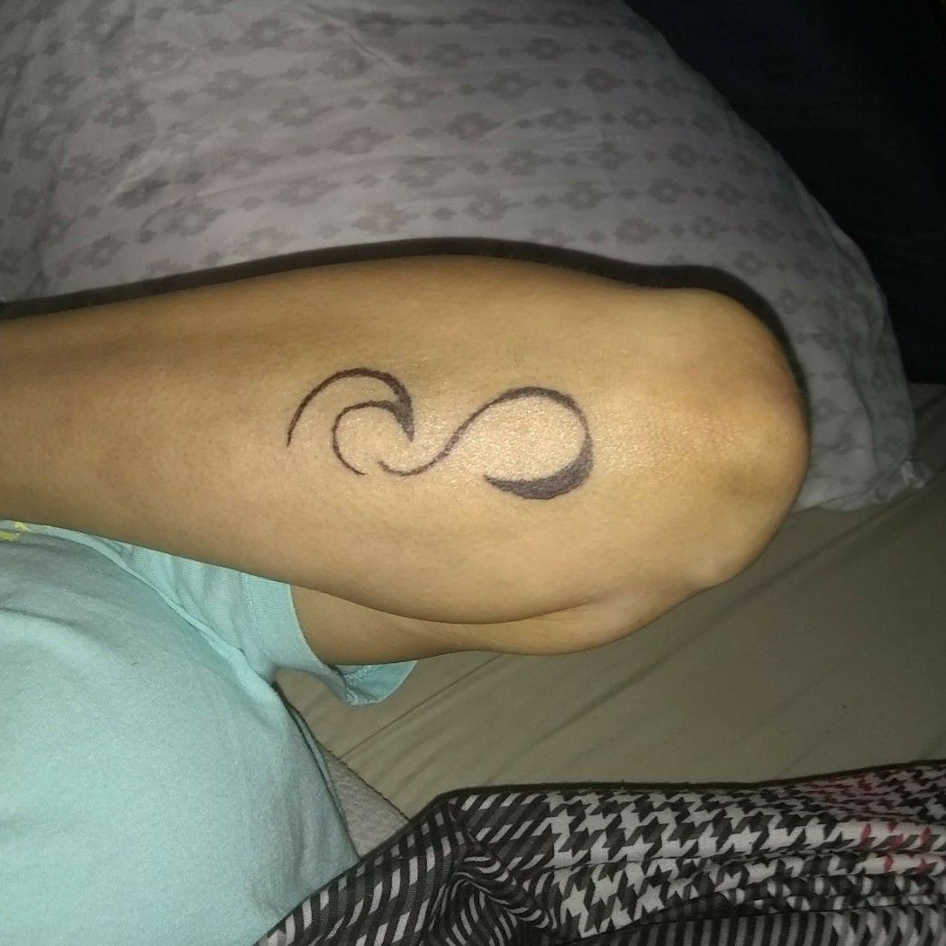 Minimalist wave and in infinity symbol tattoo on the