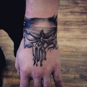 Punisher hand tattoo. "Crushed Punishment"