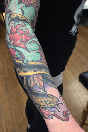 In progress peony and snake sleeve by Kevin Farrand at have hope tattoo 