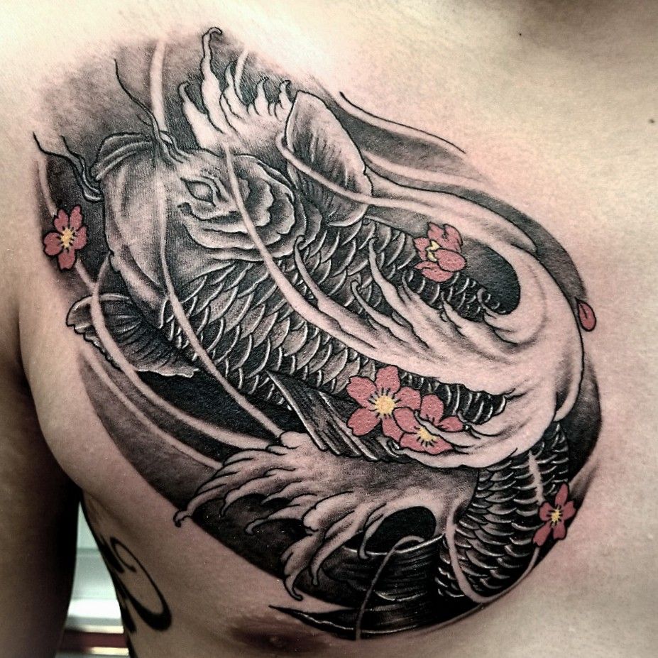 Koi Fish tattoo located on Alev Aydins chest done by