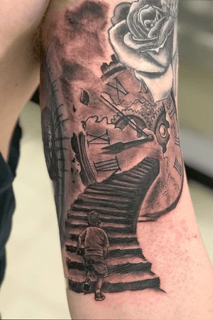 Added onto this 1/2 sleeve project. Little boy running up stairs into a broken clock. 
